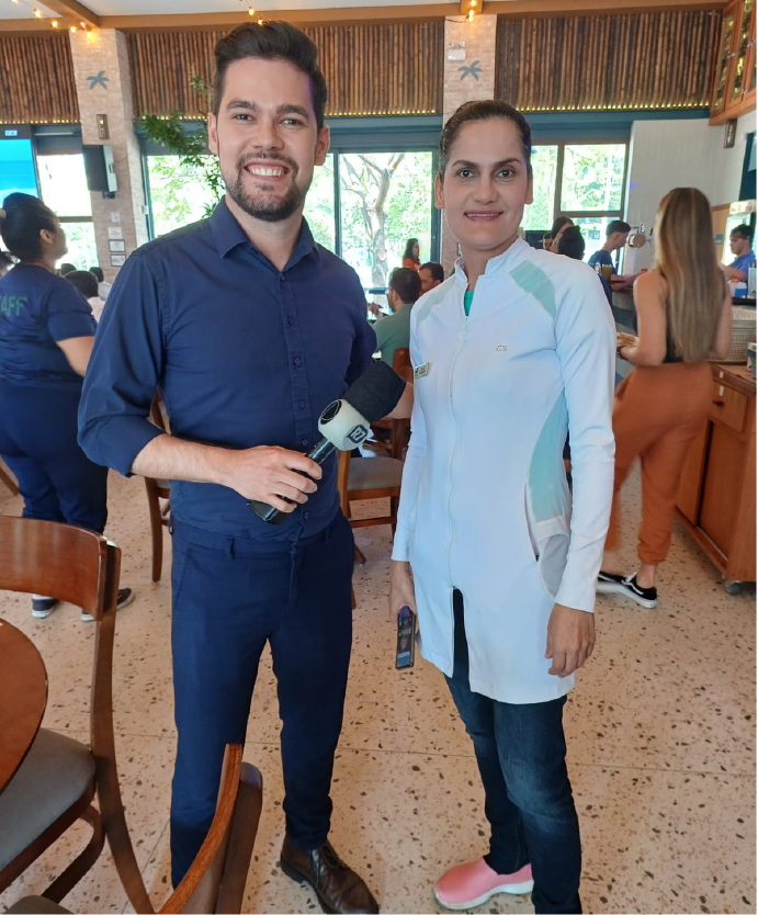 Foto da nutricionista Zânia, dando uma entrevista a TV Record